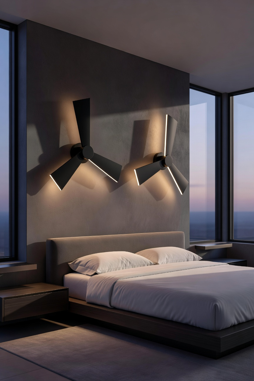 A modern bedroom featuring dramatic black sculptural wall sconces that serve as the primary wall decor above a minimalist bed.